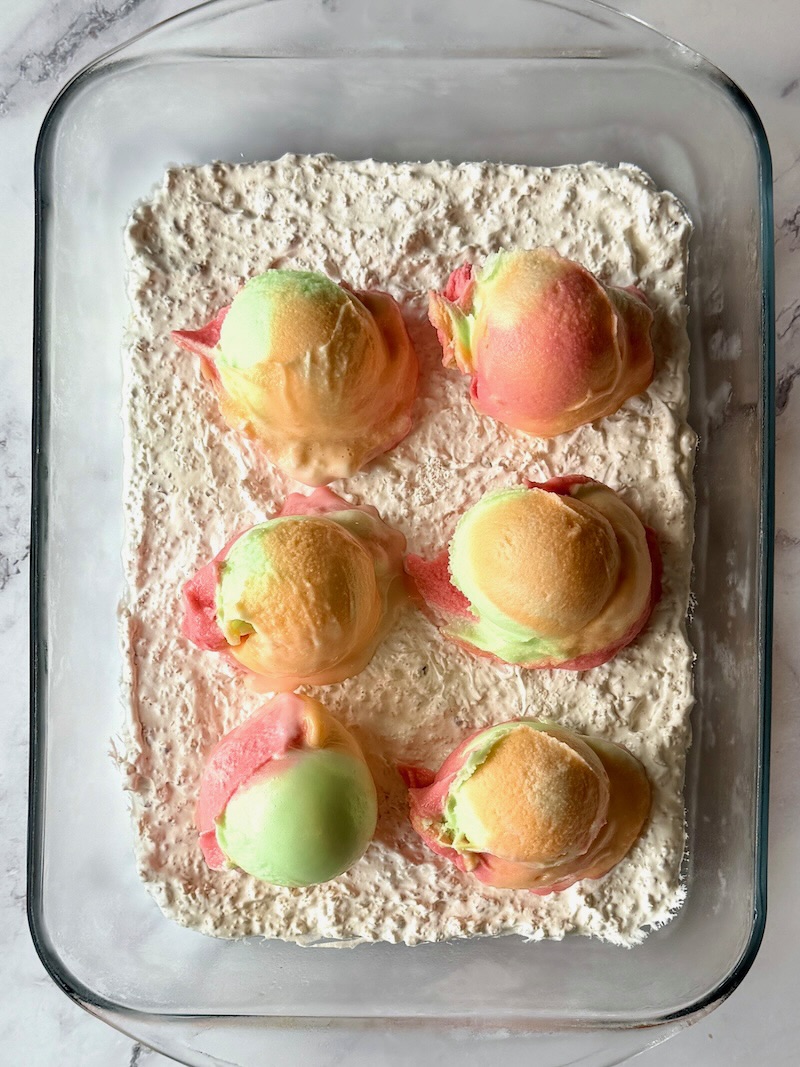 whipped cream mixture layered in the bottom of a casserole dish then topped with ice cream
