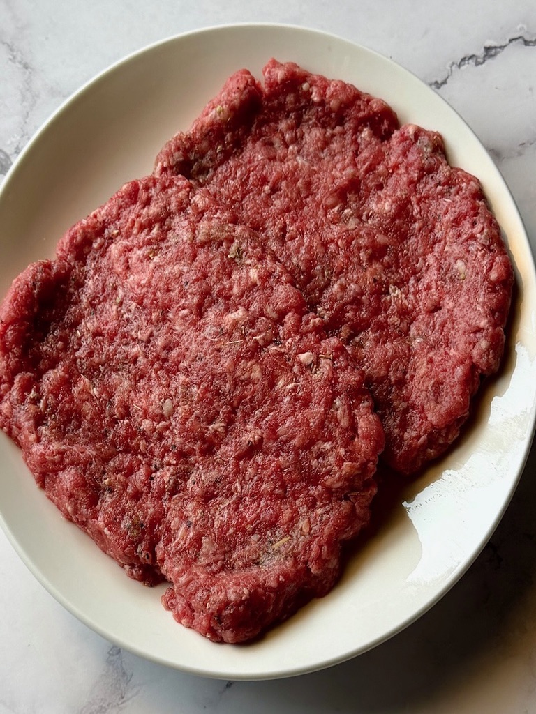 Beef patties formed in an oval shape.