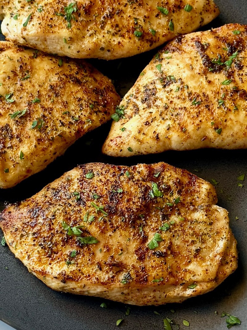 chicken breasts grilled and put on a serving plate.