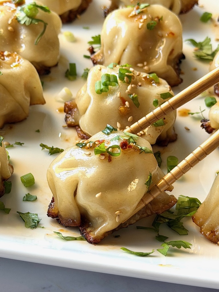Chicken dumplings with chopsticks.