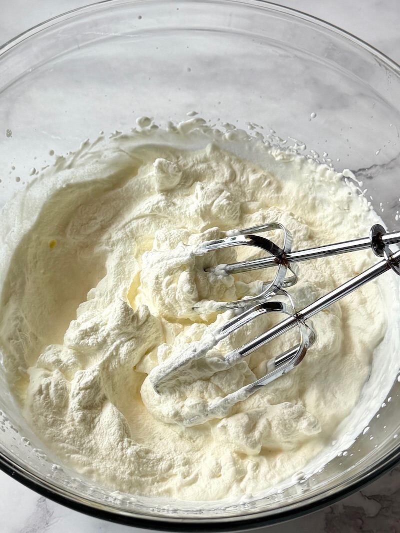 Heavy whipping cream whipped with a mixer.