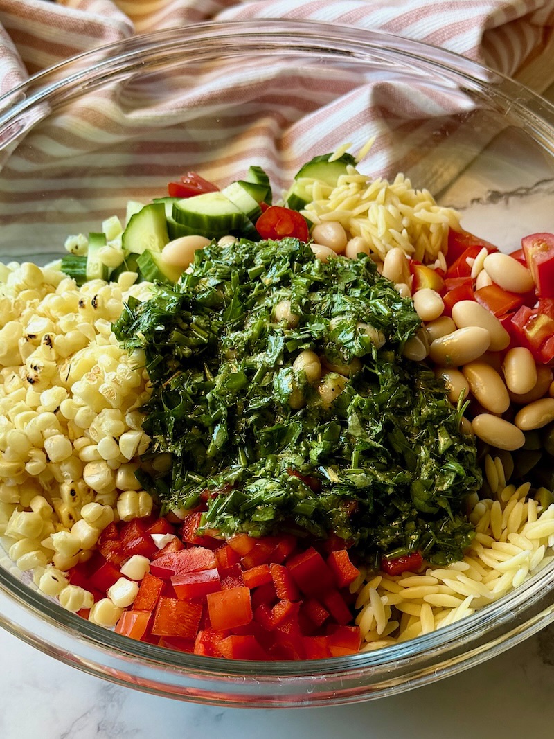 Dressing poured over salad ingredients. 