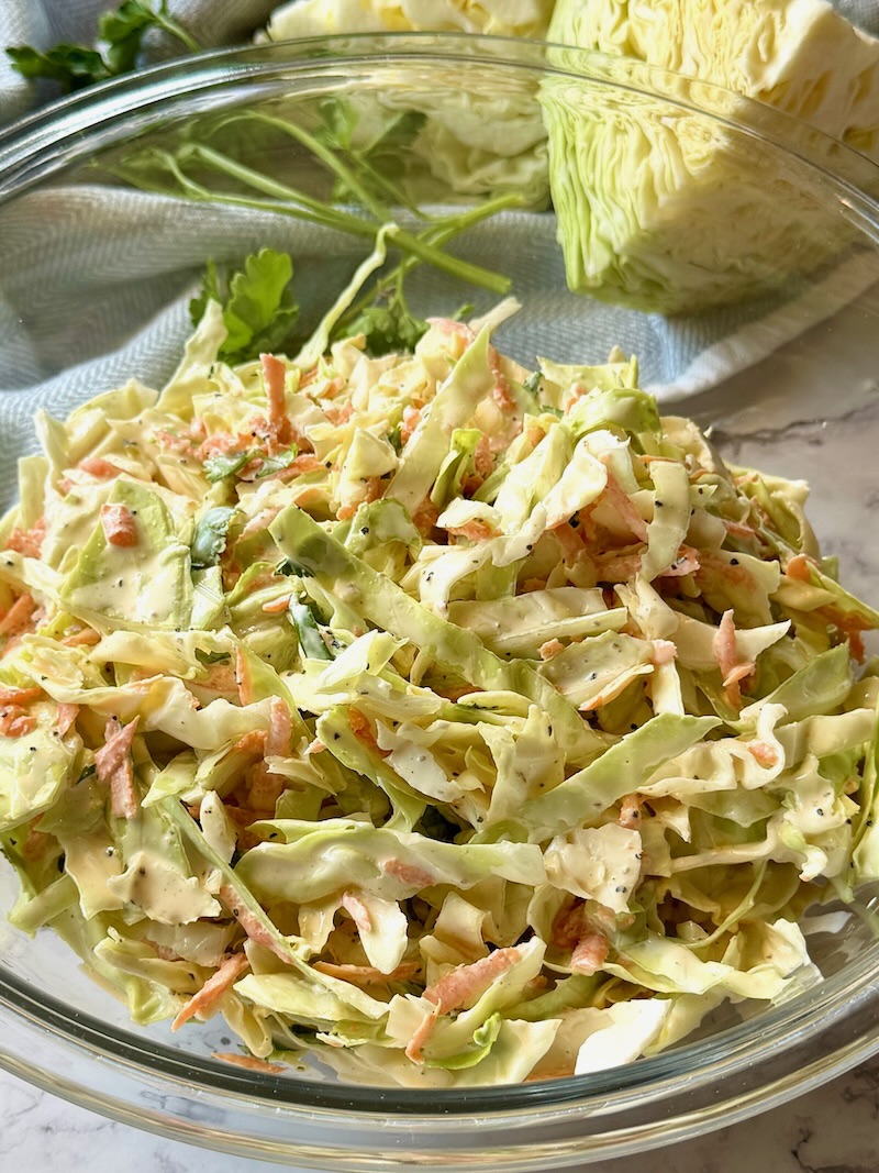 Coleslaw mixed with the dressing. 