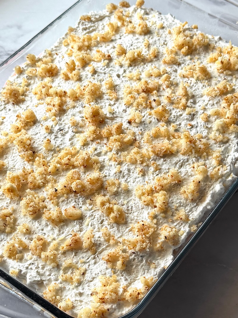 Mom's sherbet dessert assembled with cookie crumbles on top. 