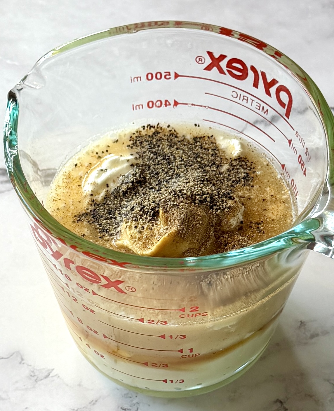 Dressing ingredients in a small measuring cup