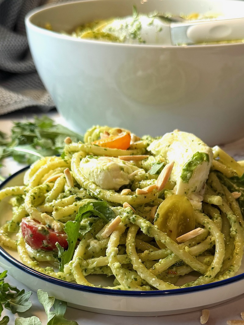 Bucatini Arugula Pesto Pasta plated on a serving plate