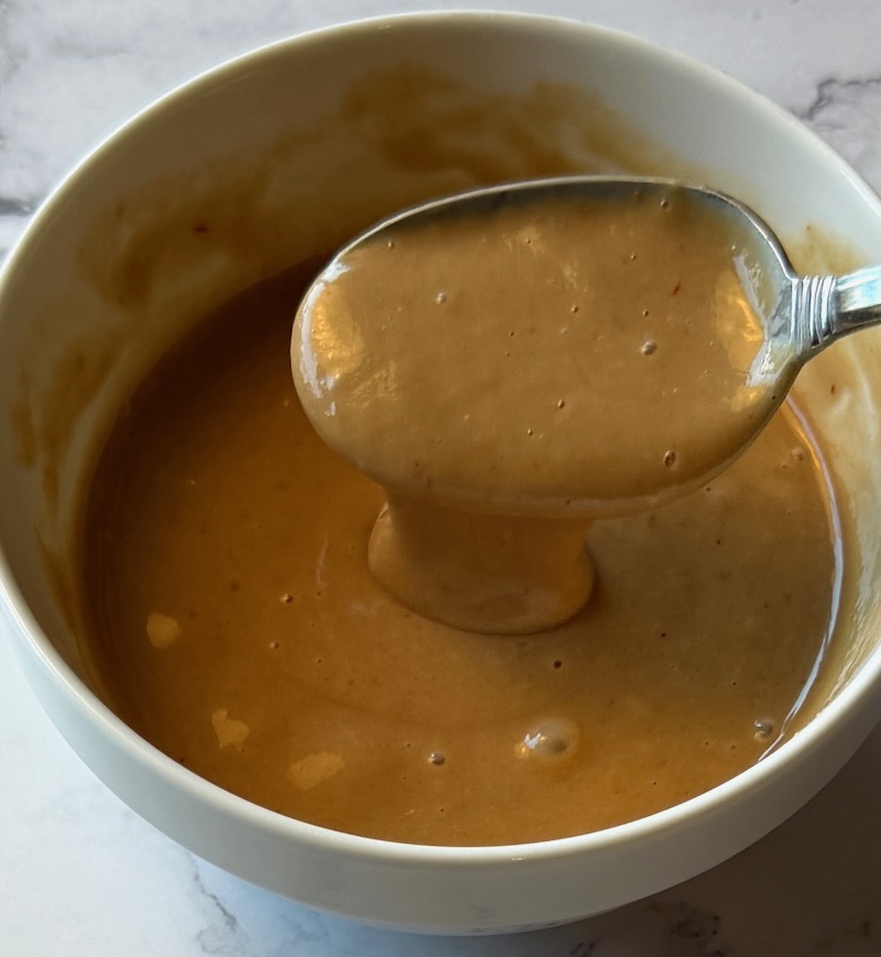Combined sauce in a small bowl with a spoon