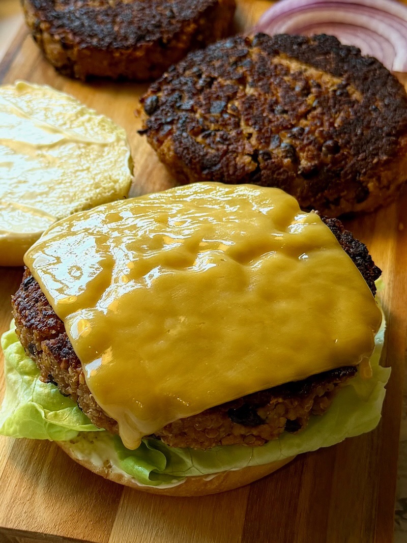 Patties on a bun with melted cheese