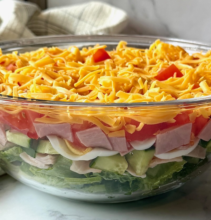 Layered salad in a clear bowl