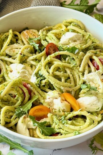 Bucatini Arugula Pesto prepared in a serving bowl.