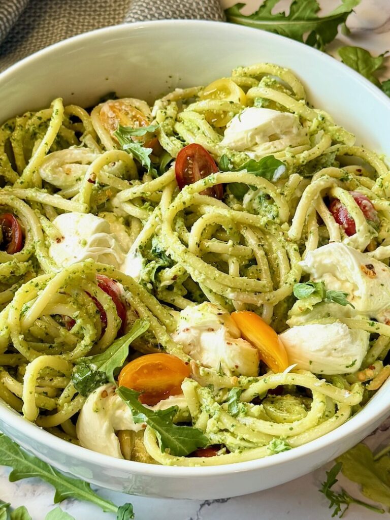 Bucatini Arugula Pesto prepared in a serving bowl.