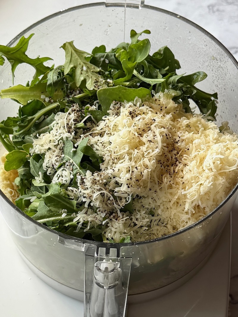 Arugula, parmesan cheese, lemon juice, salt and pepper in the food processor. 