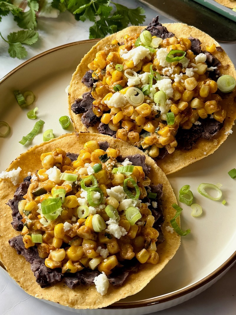 Street corn tostadas on a serving plate