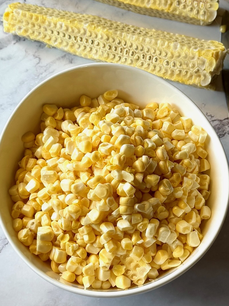 fresh corn removed from the cob and put in a bowl