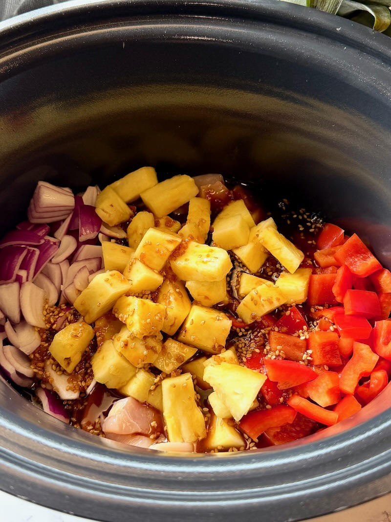 chicken, onions, and bell pepper in the slow cooker. 