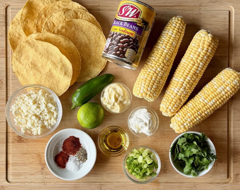 Ingredients displayed for street corn tostadas with black beans
