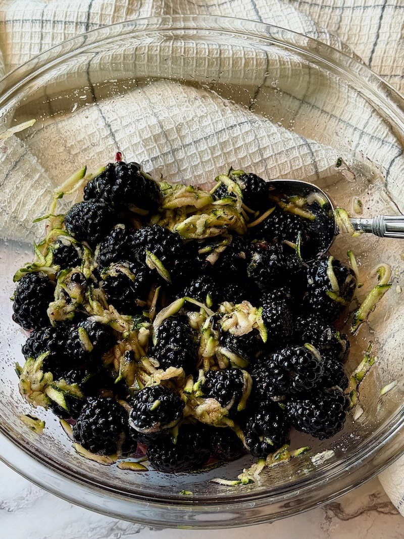 Black berries folded into zucchini mixture.