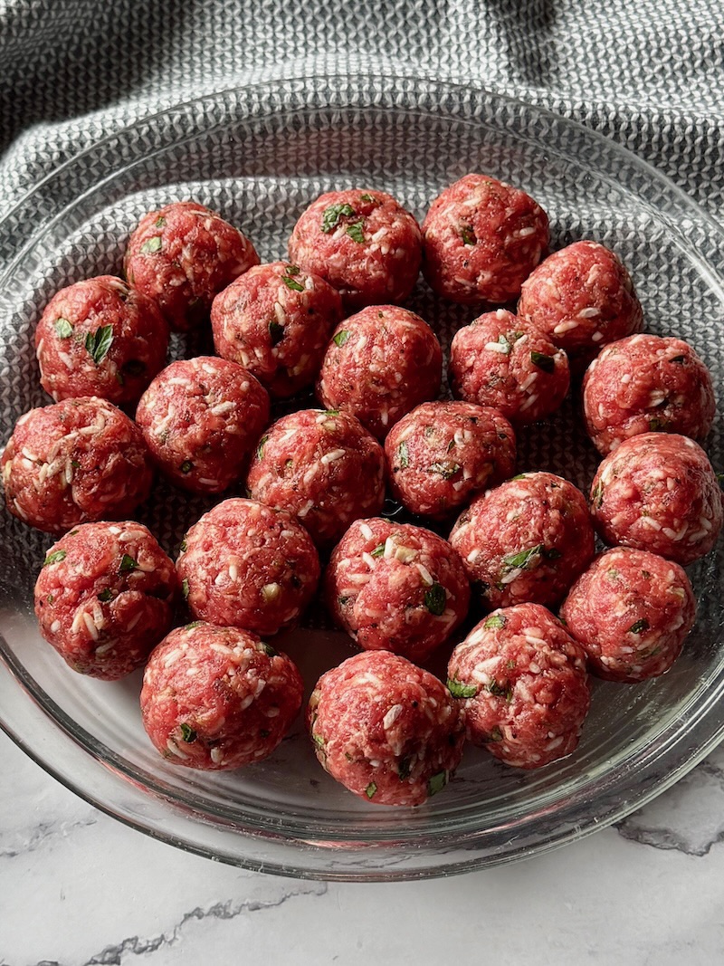 meatballs formed and on a plate.