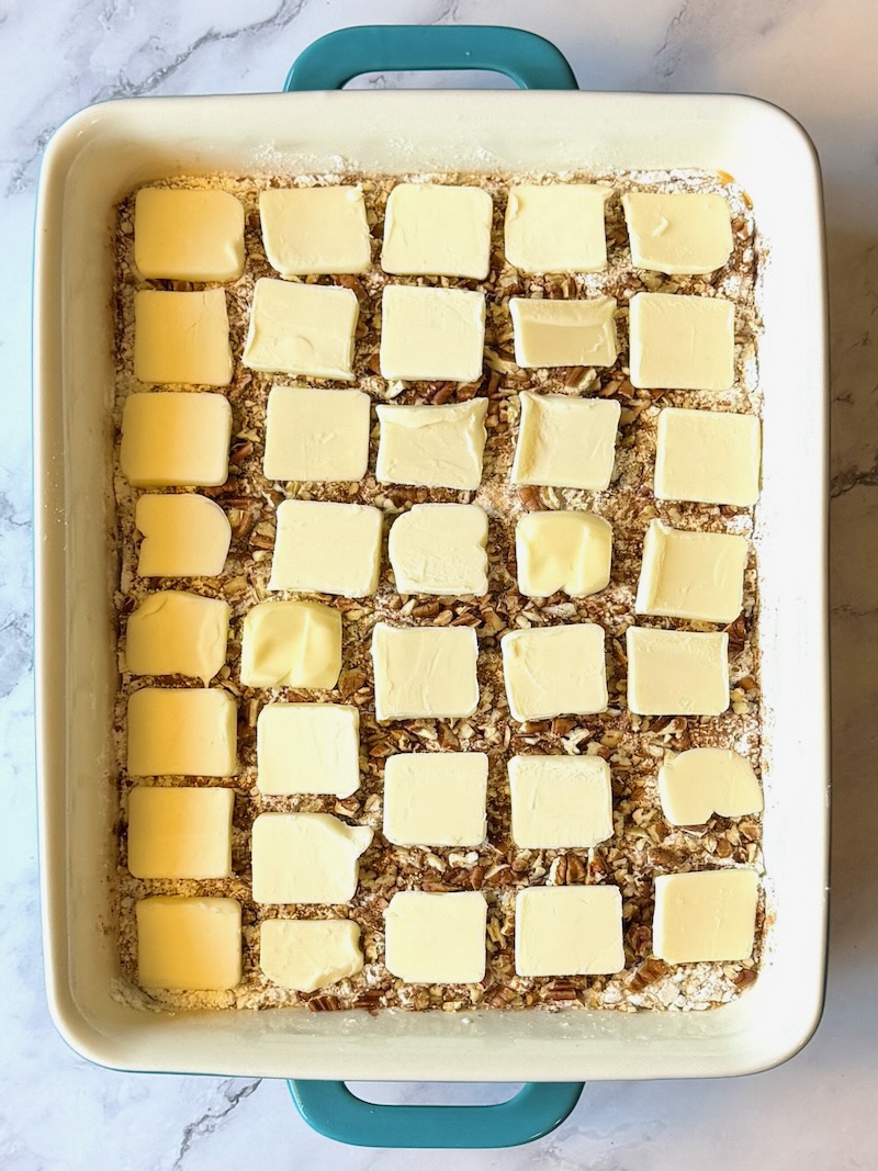 butter pads on top of the cake mix