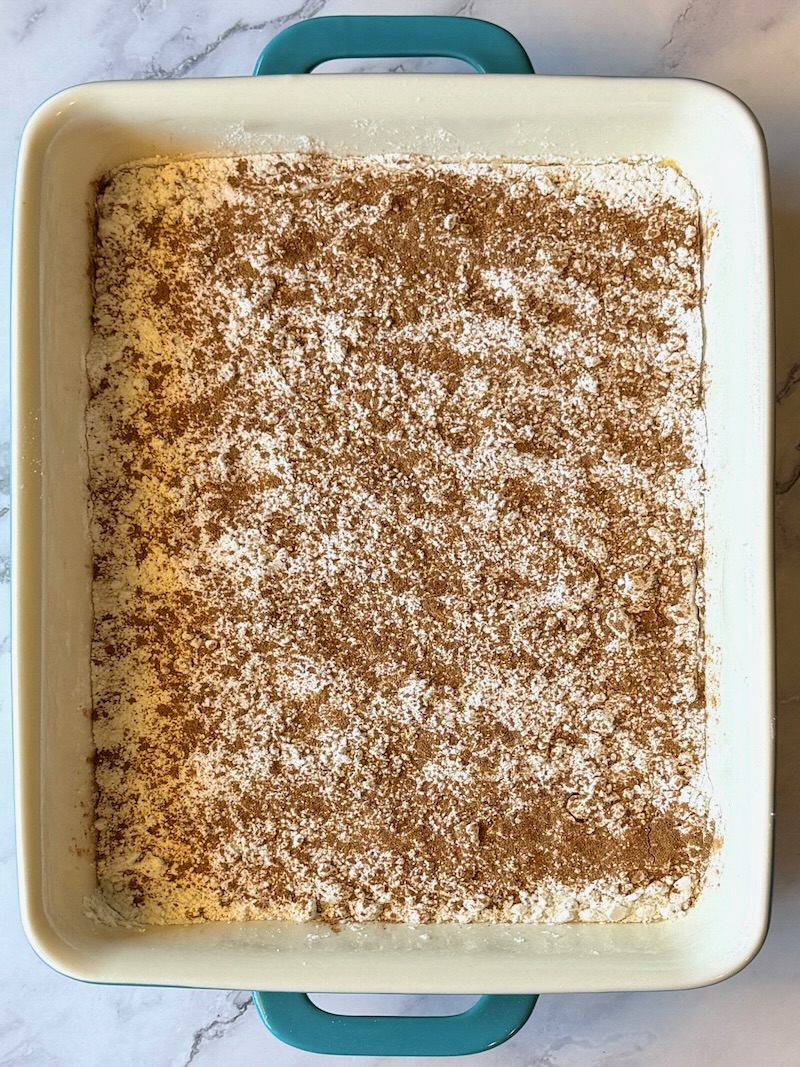 yellow cake mix, pumpkin pie spice and pecans over the pumpkin mixture 