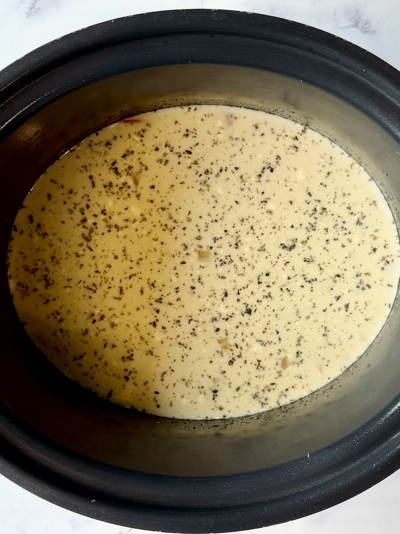 cream cheese and half and half mixed with the chicken in the slow cooker.