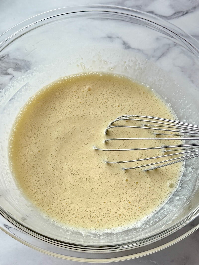 Wet ingredients mixed in a mixing bowl
