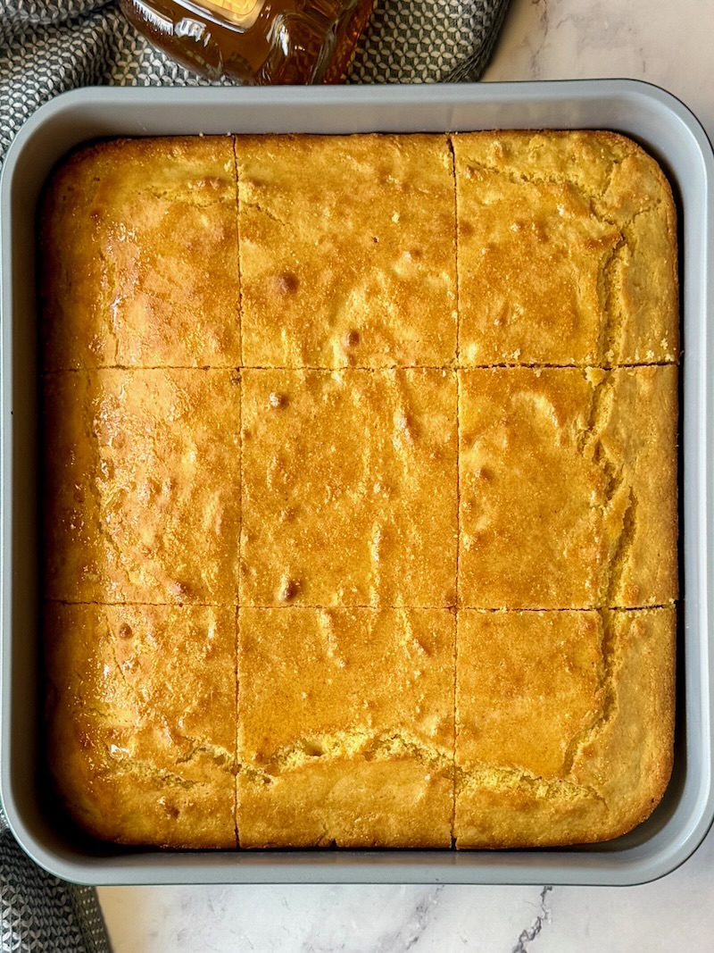 Cornbread baked with honey drizzled over the top.