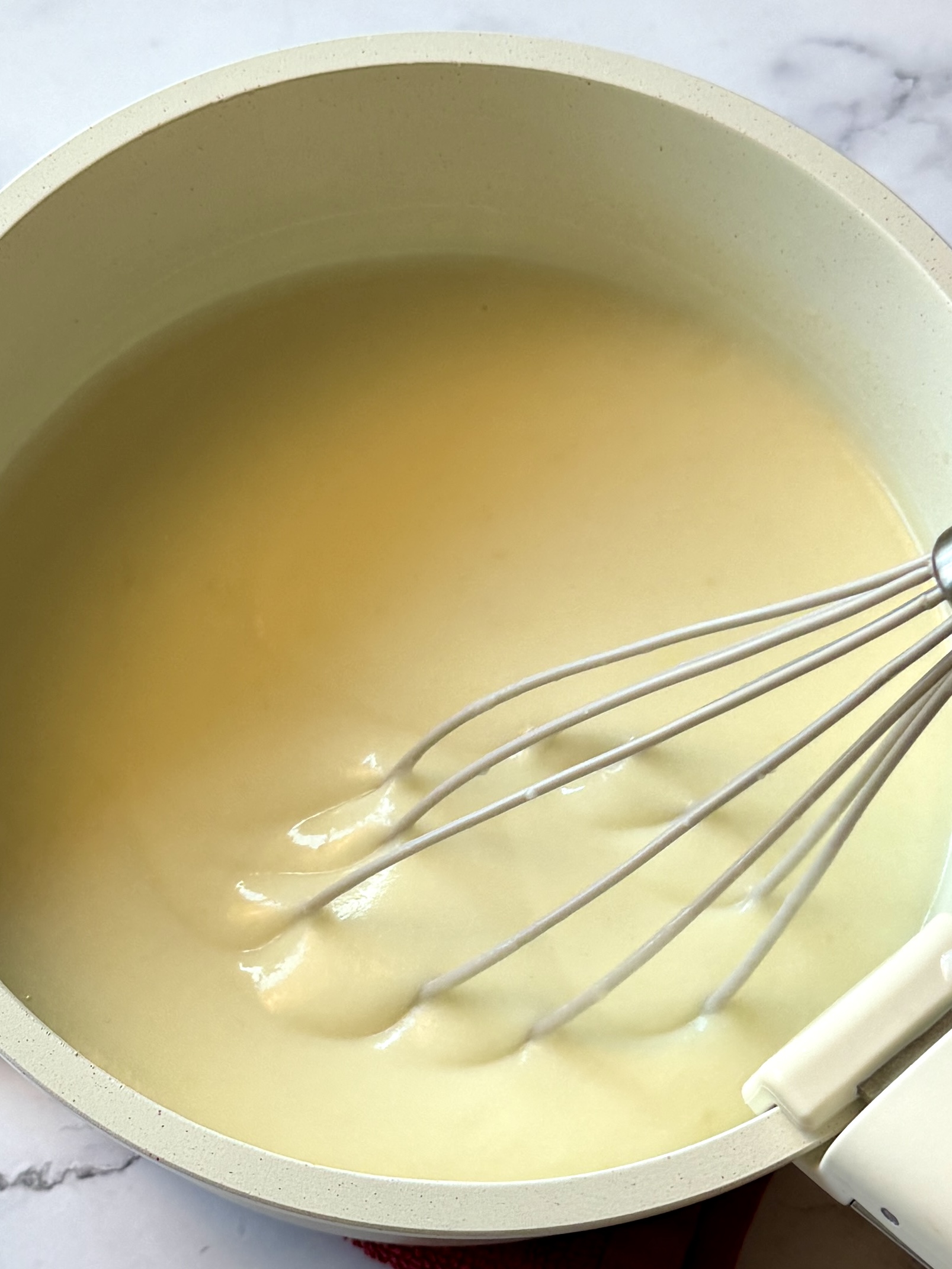 chicken broth and milk mixed with butter and flour mixture. 