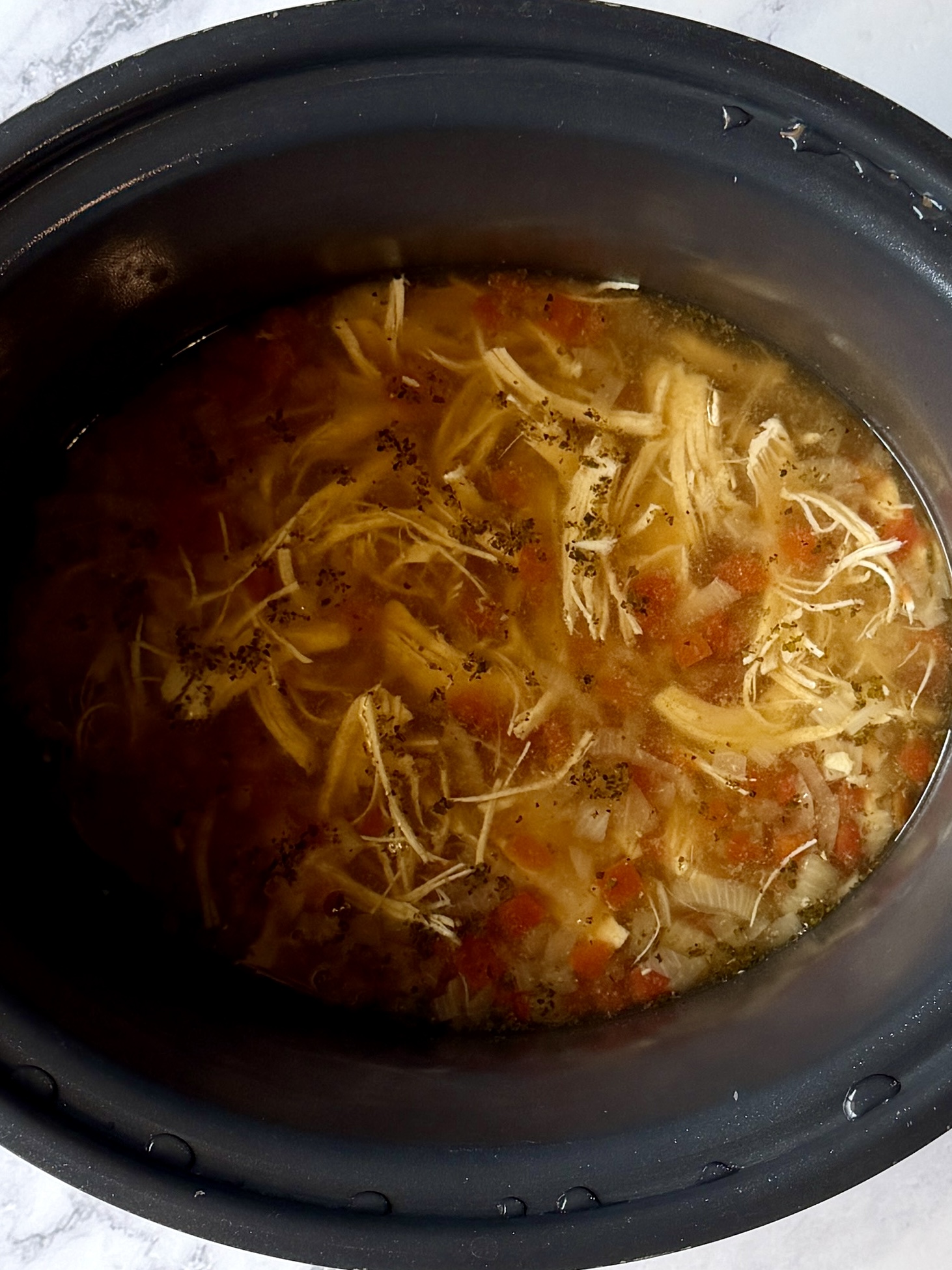 chicken shredded in the slow cooker